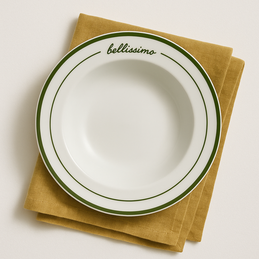 Filonina ‘Bellissimo’ Italian ceramic pasta bowl with green trim, styled on a white background with a fresh linen napkin underneath — minimal, elegant tableware inspired by Italian dining and entertaining